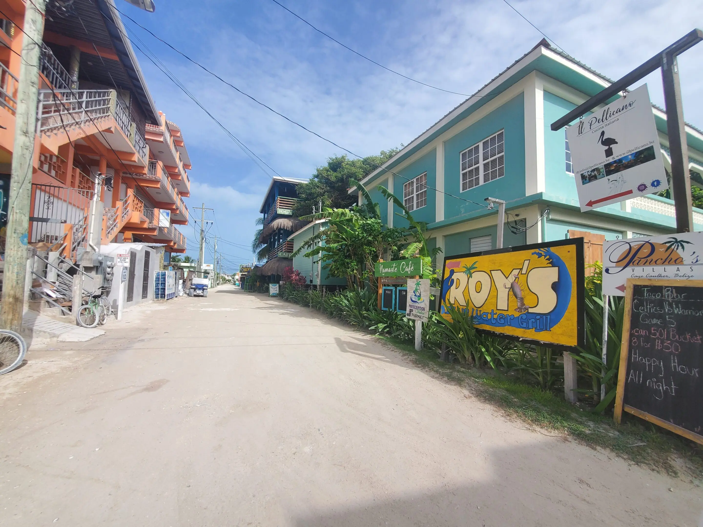 A street with many buildings and trees on the side