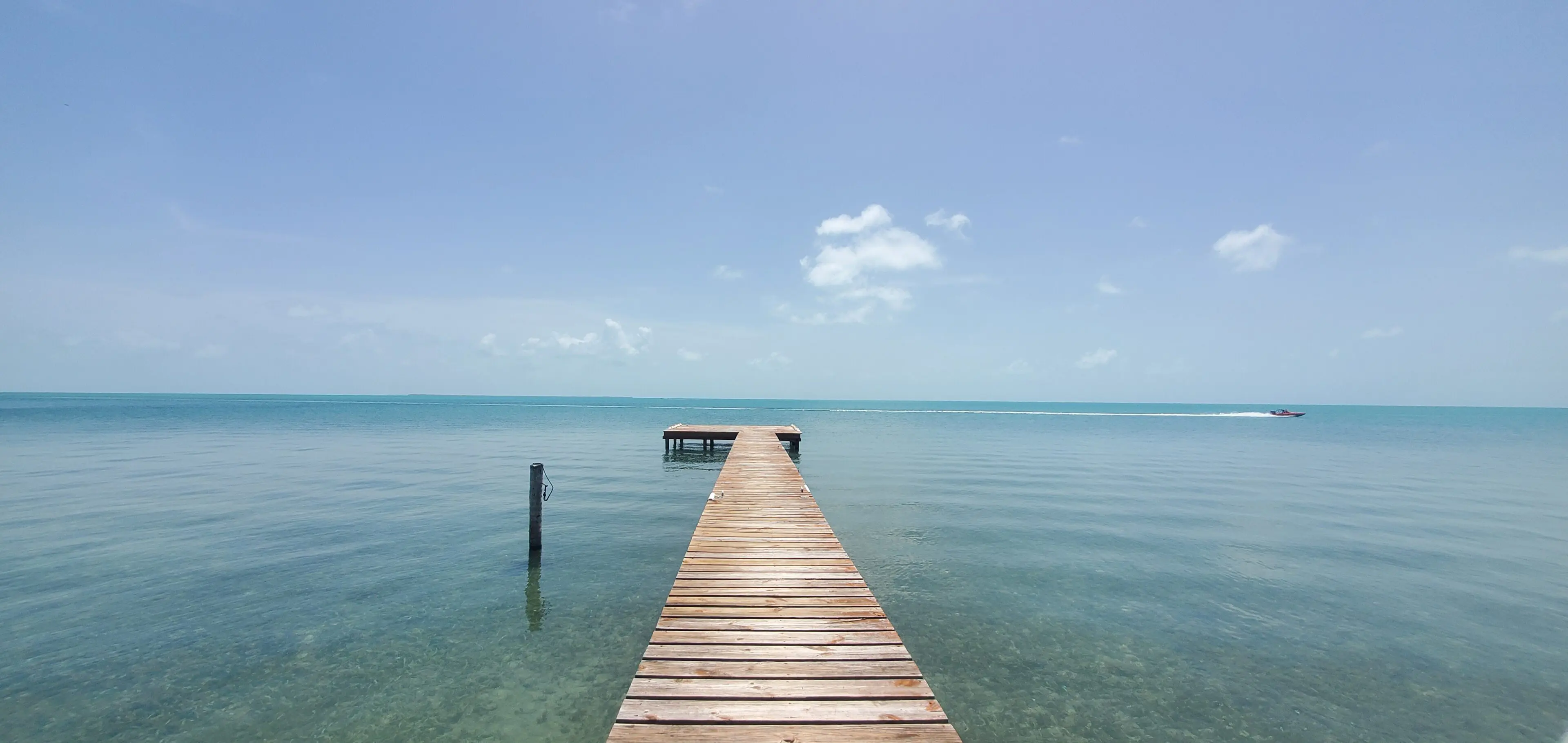 A dock in the middle of an ocean.