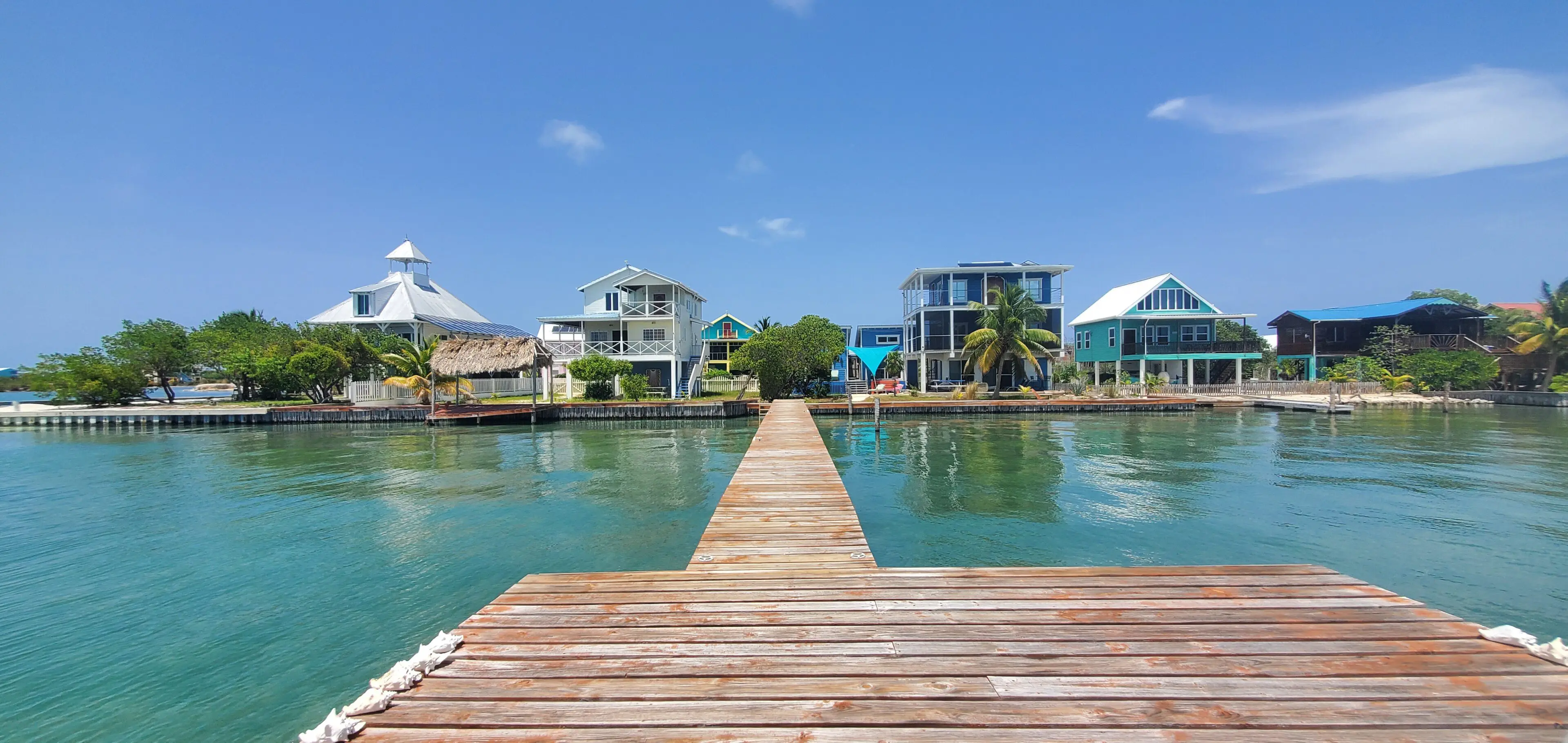 A dock with houses in the background