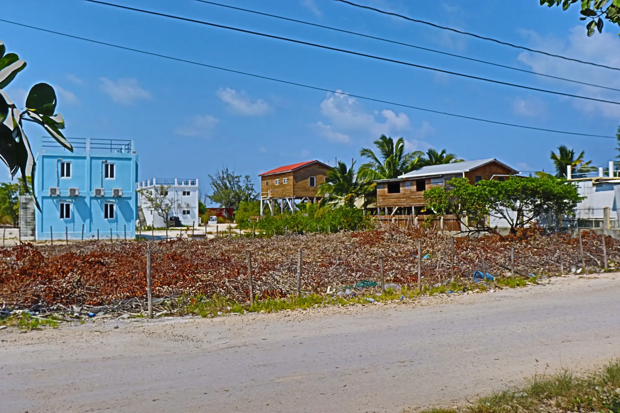 A view of some houses on the side of a road.