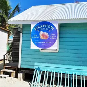 A blue building with a sign on the side of it.