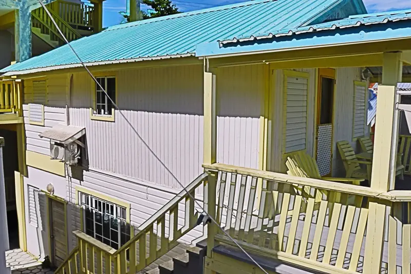 A house with stairs and a blue roof