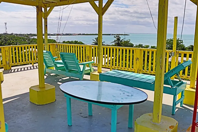 A table and chairs on the patio of a house.