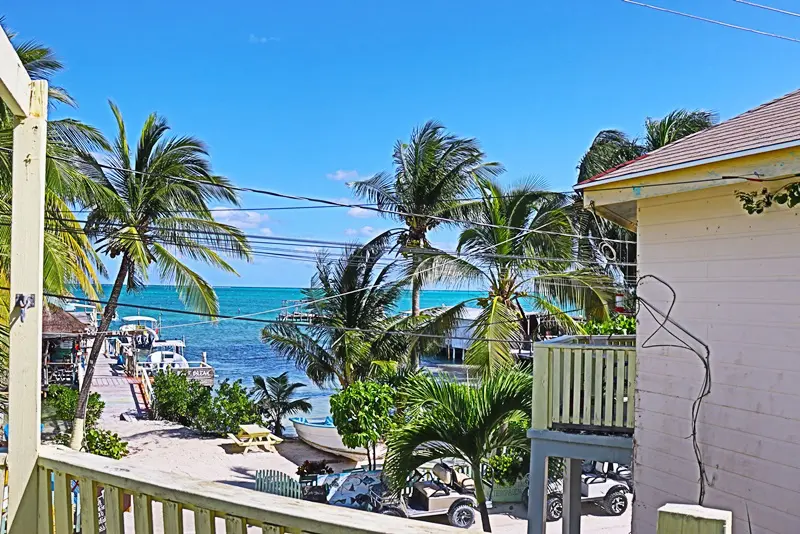 A view of the ocean from an apartment balcony.