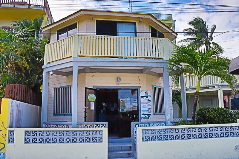 A building with a balcony and steps leading to it.