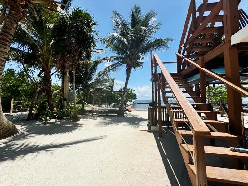 A wooden staircase leading to the beach.