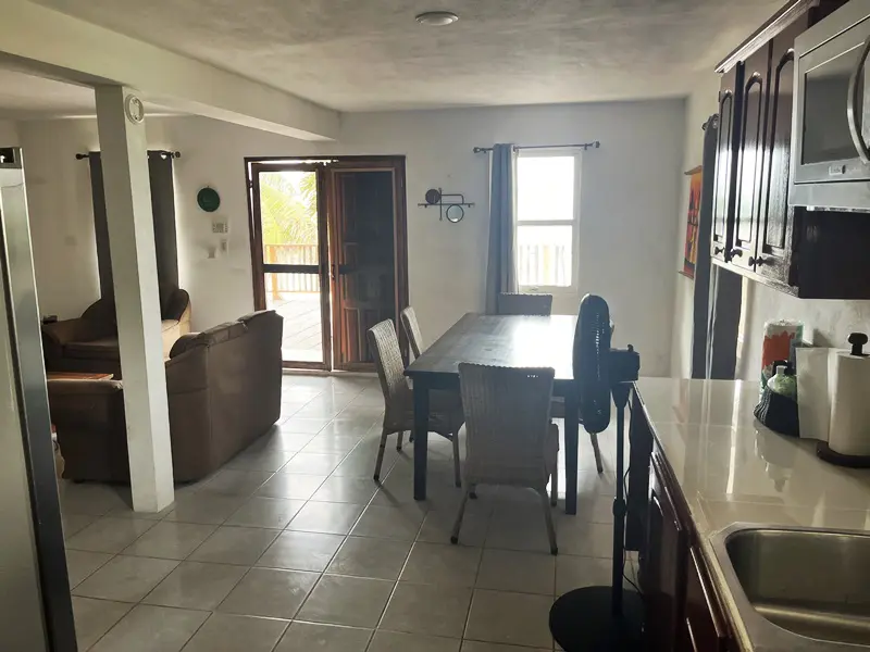 A dining room with a table and chairs in it