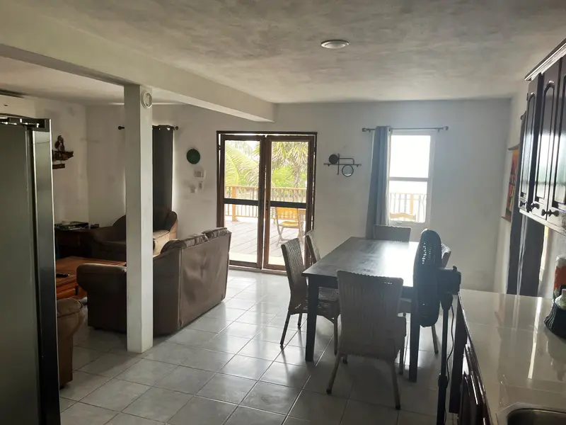 A dining room with a table and chairs in it