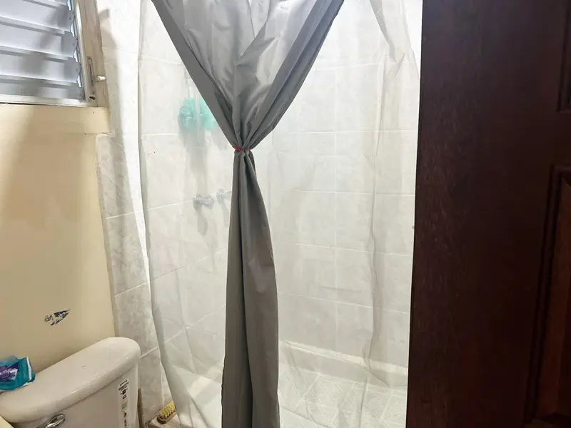 A shower curtain that is hanging on the wall.