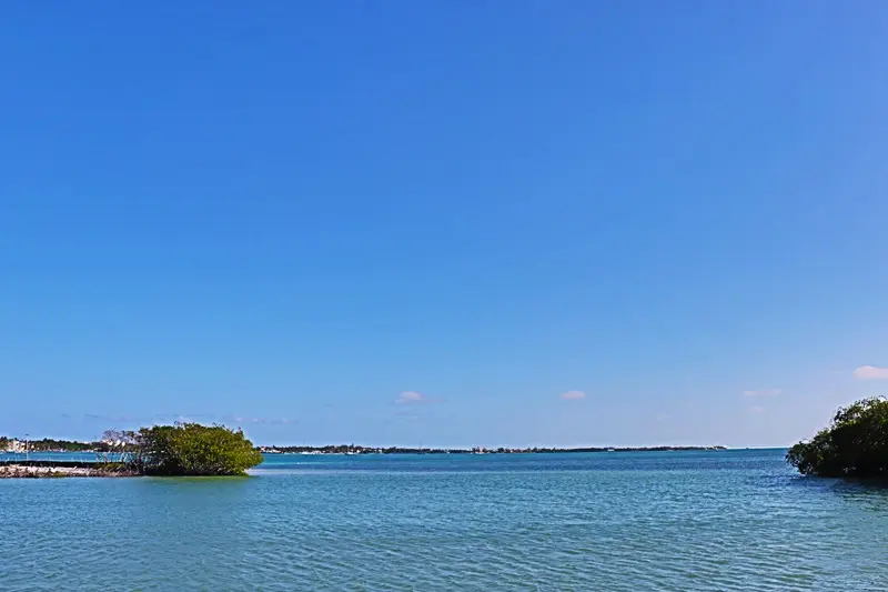 A small island in the middle of an ocean.