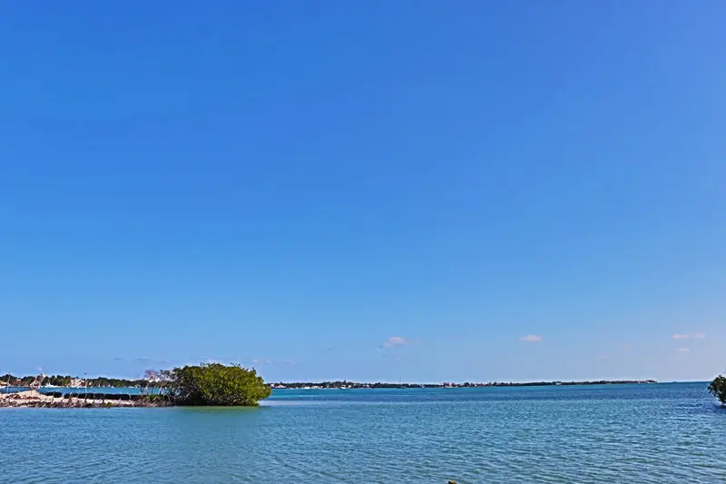 A small island in the middle of an ocean.