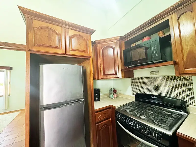 A kitchen with wooden cabinets and stainless steel appliances.