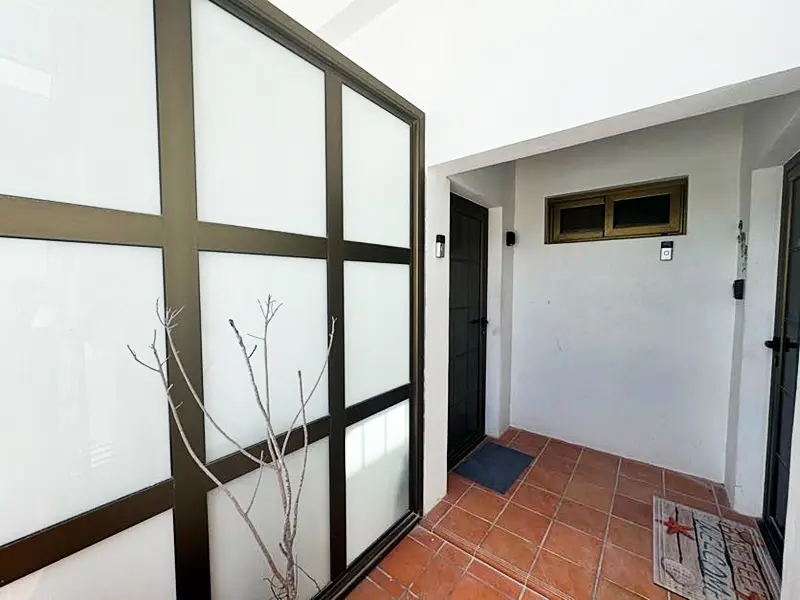 A door with glass panels in the middle of a room.